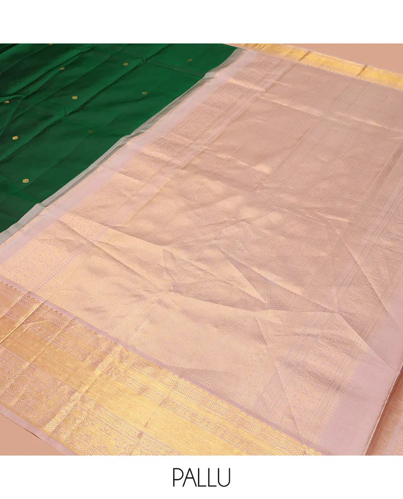 Green silk saree with zari buttas all over Its body paired with contrast zari border