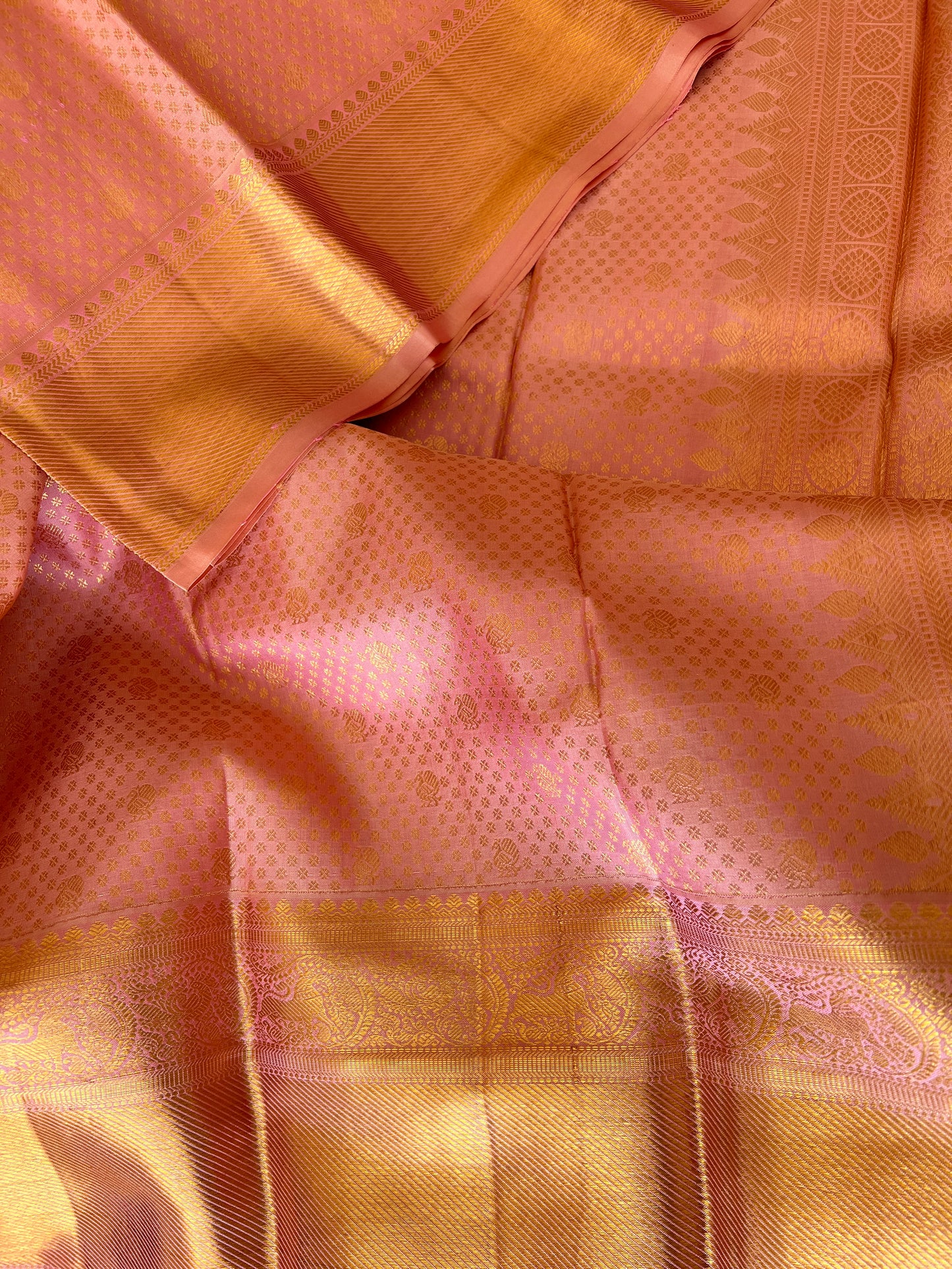 Peach Onion Pink with Gold Zari Small Peacock and Round Butta Motifs Full Body Weaved Design Zari Border Grand Tissue Silk Kanjivaram Saree