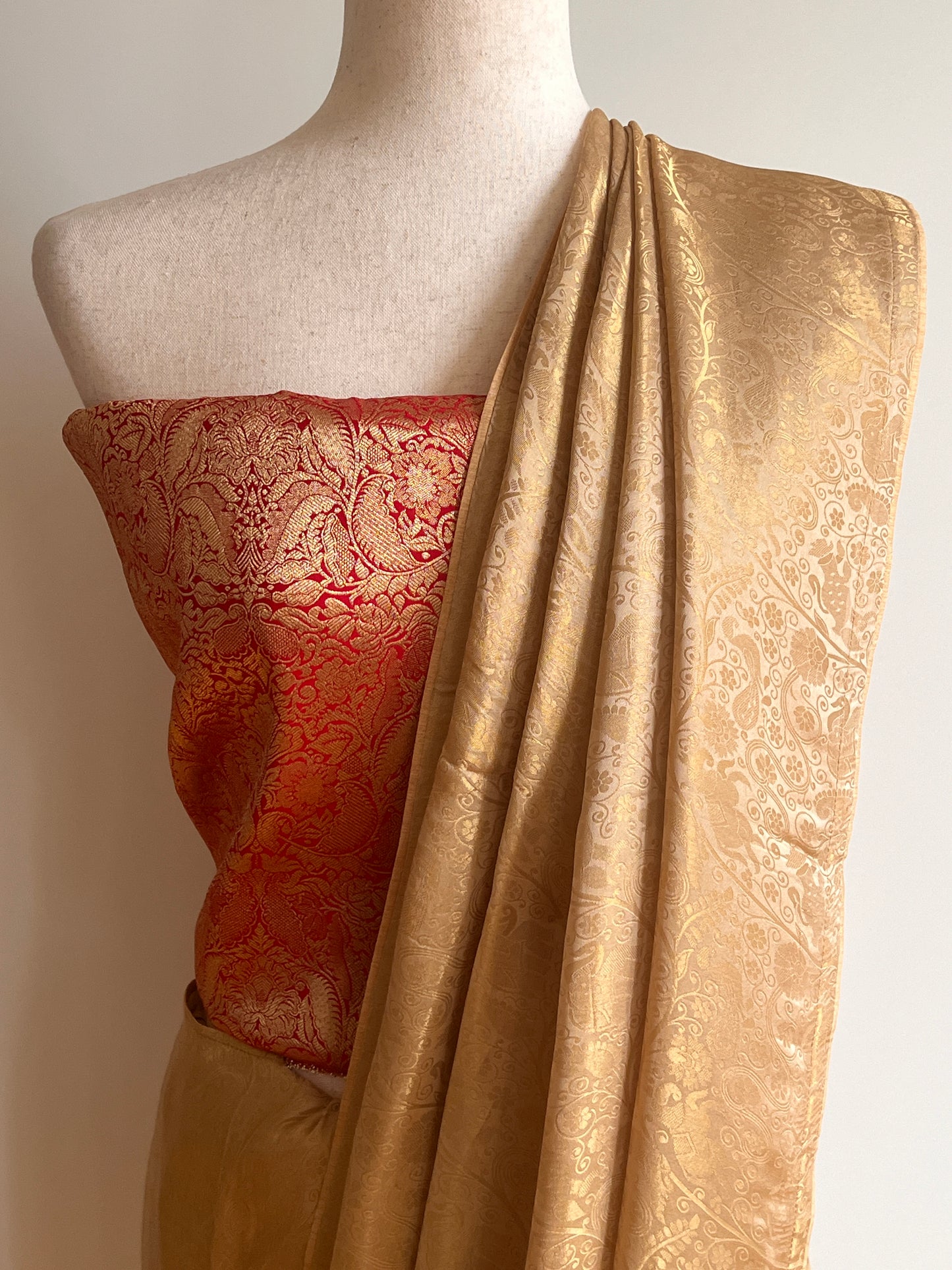 Gold Woven Viscose Fabric Saree with Unstitched Red Zari Brocade Blouse Material
