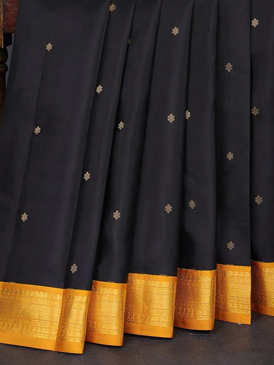 Pure kanchipuram silk saree black and dark mustard with zari woven buttas and zari woven korvai border