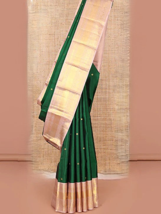 Green silk saree with zari buttas all over Its body paired with contrast zari border
