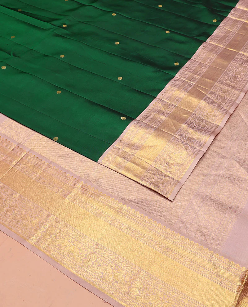Green silk saree with zari buttas all over Its body paired with contrast zari border