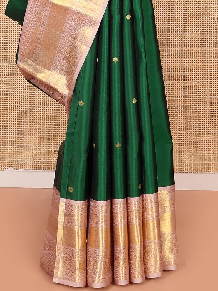 Green silk saree with zari buttas all over Its body paired with contrast zari border