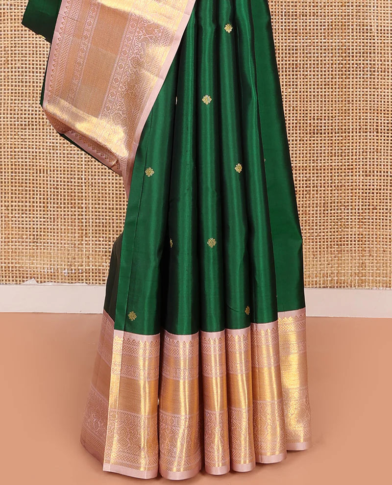 Green silk saree with zari buttas all over Its body paired with contrast zari border