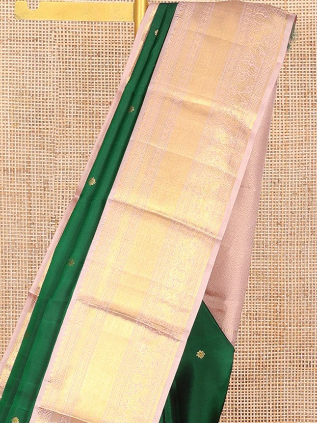 Green silk saree with zari buttas all over Its body paired with contrast zari border
